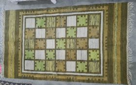 Modern rug with chess board pattern in cream, orange and green, stepped border, 168 x 101cm