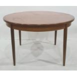 20th century teak, probably G-Plan, D-end extending dining table with circular tapering legs,