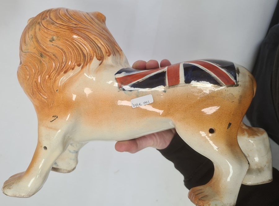 Pair of Staffordshire-style pottery lions painted with Union Jacks, 25cm high x 32cm long (2) - Image 3 of 3