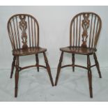 Set of four 20th century elm seated dining chairs with crinoline stretchers, turned legs, shaped and