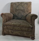 19th century armchair in foliate patterned upholstery, on turned front supports
