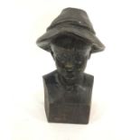 Stained and carved wood bust of a Tyrolean boy, on plinth base, 25cm high