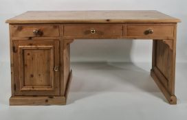 20th century pine desk with three assorted drawers and single cupboard door, on plinth base, 151cm
