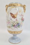 Continental porcelain vase, the barrel-shaped body with gilt border and ring handles, painted with