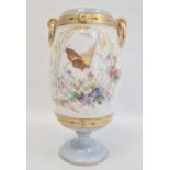 Continental porcelain vase, the barrel-shaped body with gilt border and ring handles, painted with