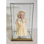 A Simon & Halbig Kammer and Reinhardt doll, with blue eyes, open mouth, teeth, blonde hair, limbed