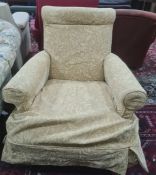 Armchair in pale gold foliate loose covers, on turned supports
