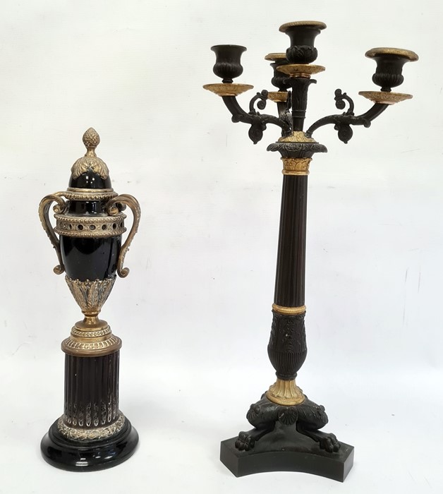 Bronzed four-branch candlestick, gilt metal mounts, tapered on tripod base and claw feet, 49cm