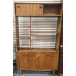 20th century teak lounge unit with assorted shelves, sliding doors above, two drawers and two