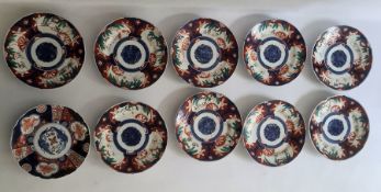 Ten various Japanese Imari porcelain plates variously decorated in typical colours, 21.5cm dia.