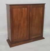 Early 20th century mahogany cupboard, the rectangular top above two doors enclosing shelves, on