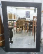 Rectangular mirror with bevelled edge plate and carved wood frame, 65cm x 90.5cm
