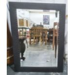 Rectangular mirror with bevelled edge plate and carved wood frame, 65cm x 90.5cm