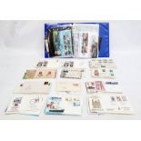 Album containing coins and First Day Covers and a quantity of loose FDCs (1 box)