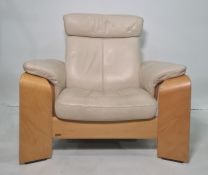 Ekorness three-seat sofa and single armchair in cream ground leather (2)