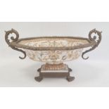 Reproduction gilt metal mounted porcelain pedestal bowl with scroll handles, shaped oval,