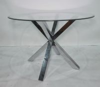 Circular glass topped breakfast table on chrome 'chopstick' type base, 120cm diameter