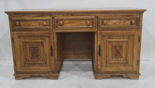 20th century oak sideboard, the rectangular top above three drawers, two cupboard doors and