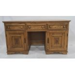 20th century oak sideboard, the rectangular top above three drawers, two cupboard doors and