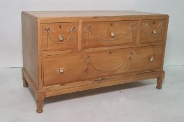 20th century low pine chest of four assorted drawers, turned and fluted supports, 96.5cm x 56.5cm