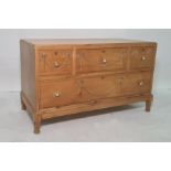 20th century low pine chest of four assorted drawers, turned and fluted supports, 96.5cm x 56.5cm