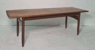 20th century teak (possibly G-Plan) narrow coffee table, the rectangular top on turned supports,
