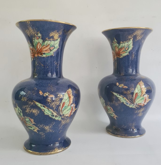 Pair of Rialto ware blue lustre vases decorated with butterflies (one repaired) (2)