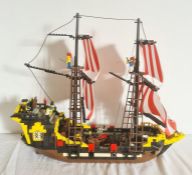 A Lego pirate ship, with pirate Lego figures, 45cm high x 51 long