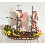 A Lego pirate ship, with pirate Lego figures, 45cm high x 51 long