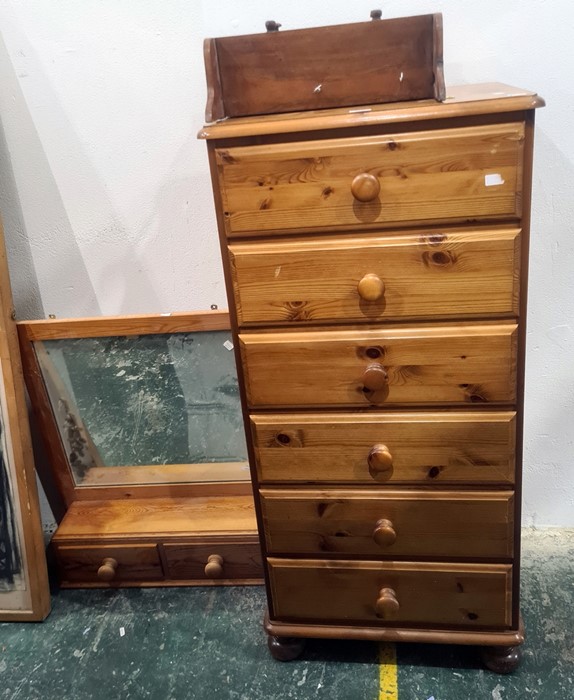 20th century narrow pine chest of six drawers, a dressing table mirror and a pine wall-hanging shelf