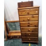 20th century narrow pine chest of six drawers, a dressing table mirror and a pine wall-hanging shelf