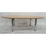 Light oak coffee table with rounded ends, on chrome supports, marked underneath 'Brevettato',