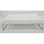 Rectangular white perspex coffee table on chromed base, 110cm x 30cm