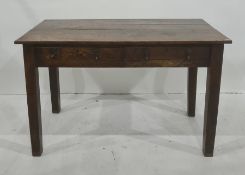 Early 20th century oak desk, the rectangular plank top above two drawers, on square section