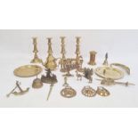 Set of four brass table candlesticks, 22.5 cm high, bronzed metal matchholder surmounted by figure