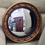 Circular convex mirror in gilt decorated moulded ball frame, 46.5cm diameter