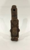 Pre-Columbian Peru Inca Chimu ware terracotta flute in the form kneeling deity with folded arms,