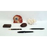 Two vintage propelling pencils, a carved wooden nut-shaped box, another carved wooden box, an