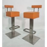 Pair of modern breakfast bar stools covered in orange, on chrome-style bases  80 cms h.  they dont