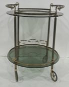 Two-tier drinks trolley, the smoked circular glass top with metal handles, smoked glass undertier
