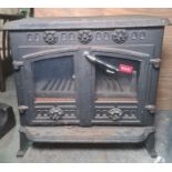 Cast iron stove with two glazed doors, 63cm x 60cm Condition ReportThe depth is 38cm or 44cm