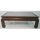 Rectangular coffee table with glass top covering the latticework design, the whole in the Chinese