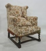 Early 20th century wingback armchair on barleytwist front supports, stretchered base