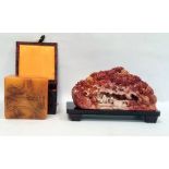 Simulated soapstone resin carving of wooded scene and the hardwood stand, 23cm side and a variegated