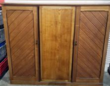 Early 20th century oak squat three-door wardrobe with mirrored central door, 178cm x 156.5cm