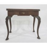 A George III taste mahogany card table, Irish, the shaped top opening to reveal green baize and