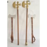 Two pairs of wood and metal reproduction axes, one pair having decorative trefoil shape