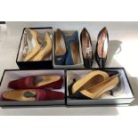 Various boxed Chanel shoes, sizes 39 and 39 and half, to include maroon suede with the Chanel logo