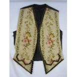 Mid 19th century front panels of a gentleman's waistcoat, machine embroidered, the black satin