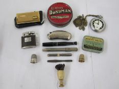 1920's/30's cigarette holder, a silver thimble, Ingersoll white metal pocket watch, cigarette